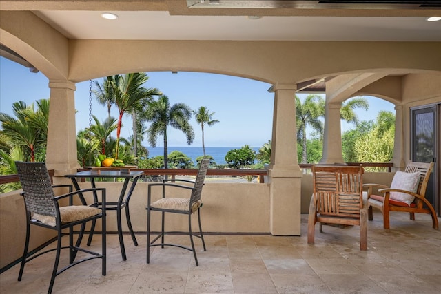 view of patio / terrace with a water view