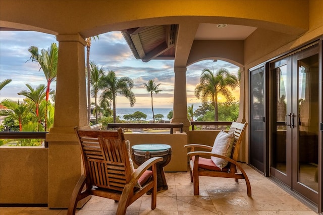 balcony at dusk with a water view