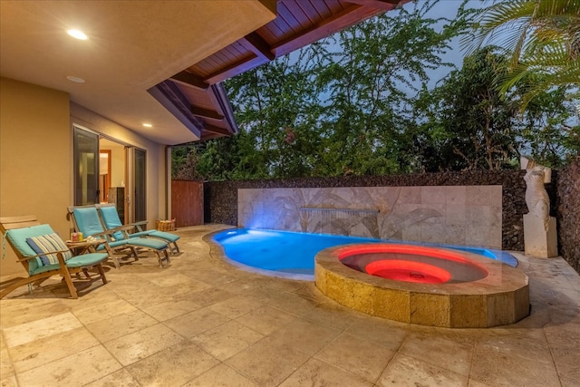 view of pool featuring an in ground hot tub and a patio area