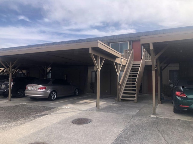 view of parking / parking lot with a carport