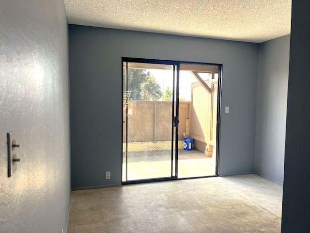 empty room featuring a textured ceiling