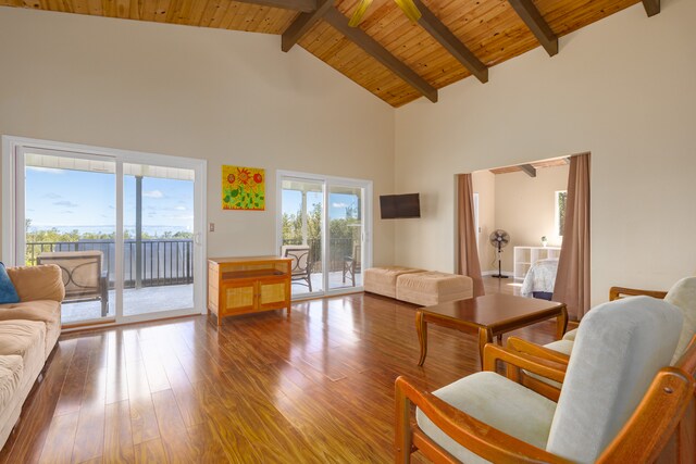living room with beam ceiling, hardwood / wood-style floors, high vaulted ceiling, and wood ceiling
