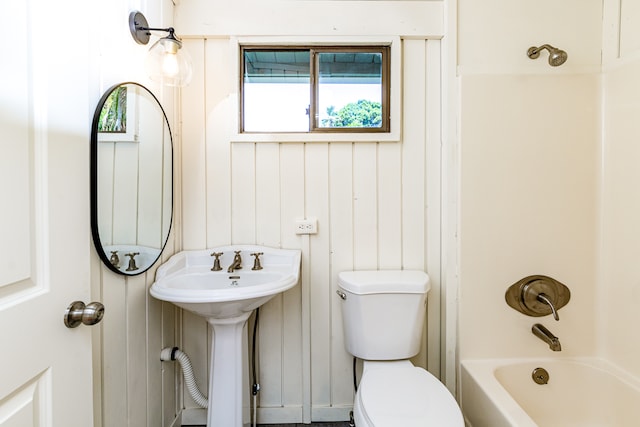 full bathroom with sink, shower / bath combination, and toilet