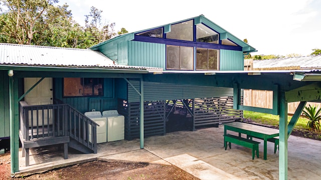 exterior space featuring a patio and washer and clothes dryer