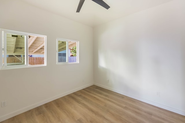 unfurnished room featuring ceiling fan and light hardwood / wood-style flooring