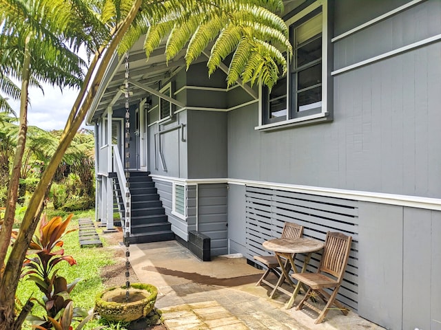 entrance to property featuring a patio area