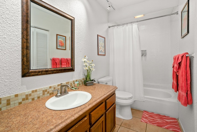 full bathroom with toilet, vanity, shower / bath combo, tile patterned flooring, and decorative backsplash