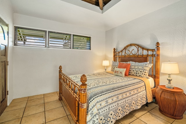 bedroom with light tile patterned floors