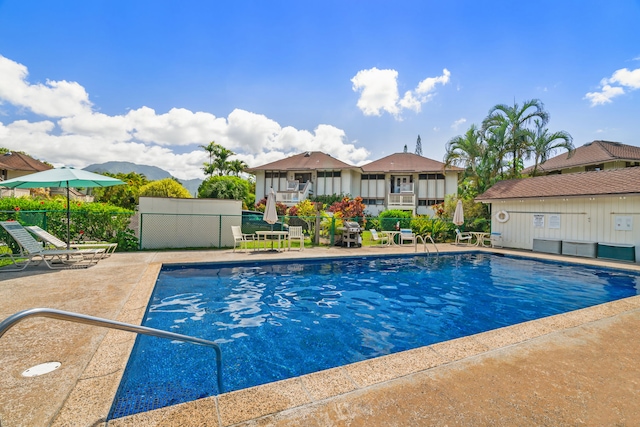 view of swimming pool featuring a patio area