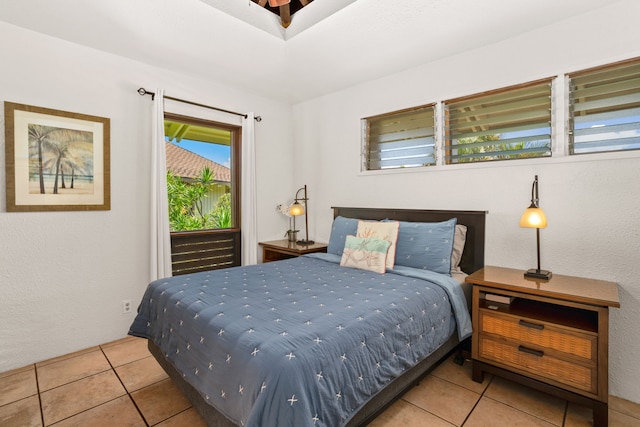 bedroom with light tile patterned floors