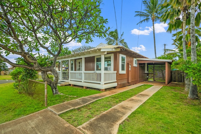 bungalow with concrete driveway, an attached carport, and a porch