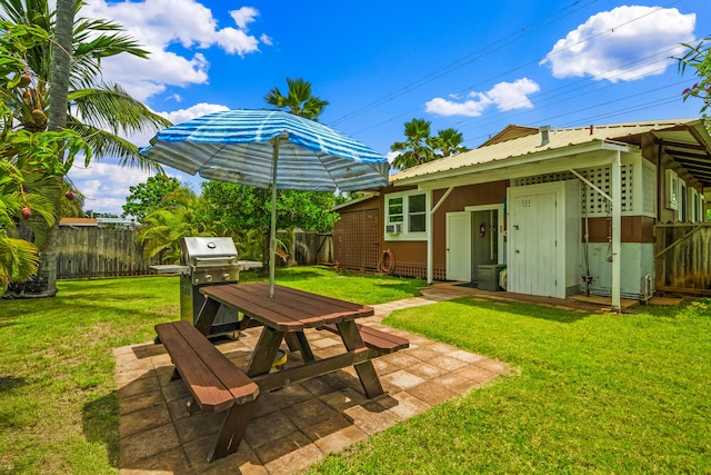 view of yard with outdoor dining area and a patio