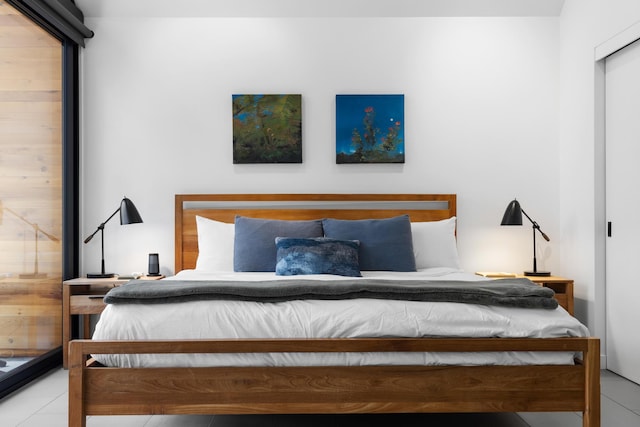 bedroom with light tile patterned floors