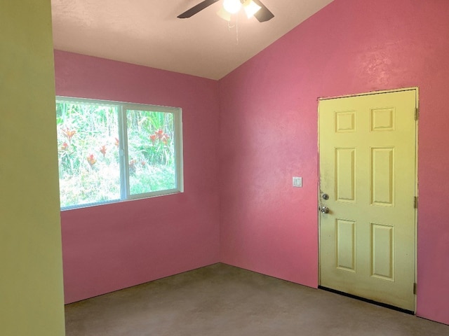 spare room with lofted ceiling and ceiling fan