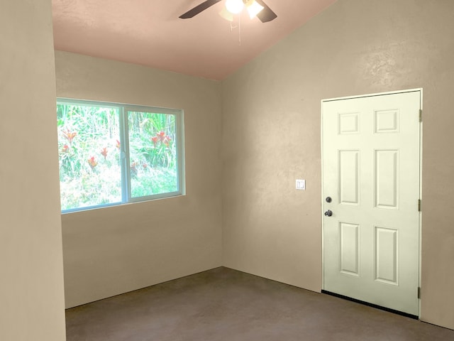 unfurnished room featuring vaulted ceiling and ceiling fan