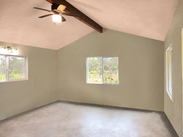 spare room featuring ceiling fan, plenty of natural light, and vaulted ceiling with beams