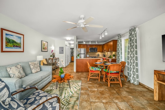 living room featuring electric panel and ceiling fan