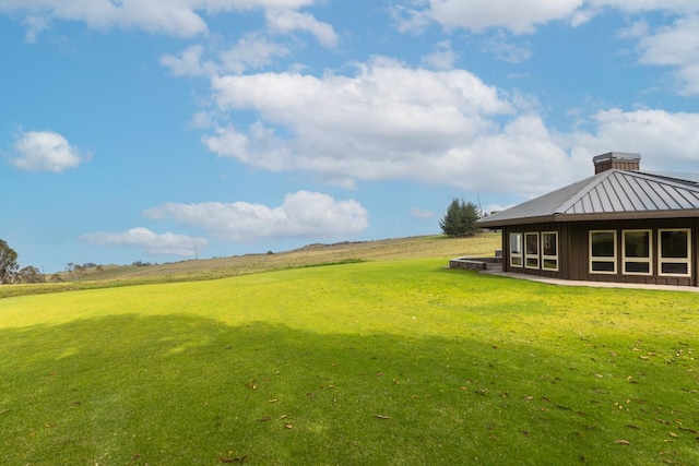 view of yard with a rural view