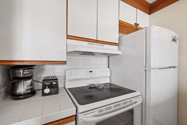 kitchen featuring white cabinets, white appliances, tile countertops, and tasteful backsplash