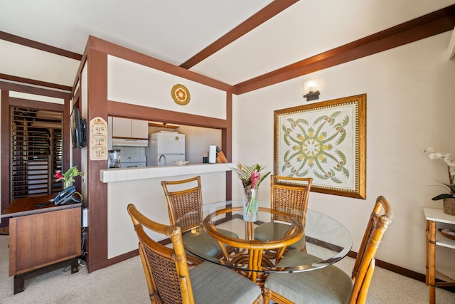 view of carpeted dining space