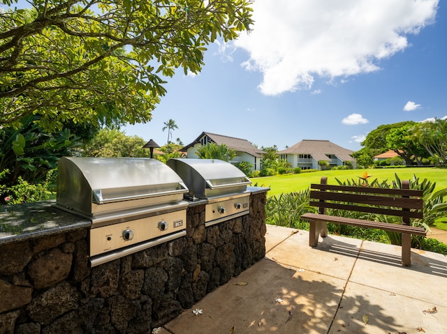 view of patio with area for grilling and an outdoor kitchen