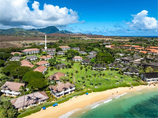 aerial view with a water view and a view of the beach