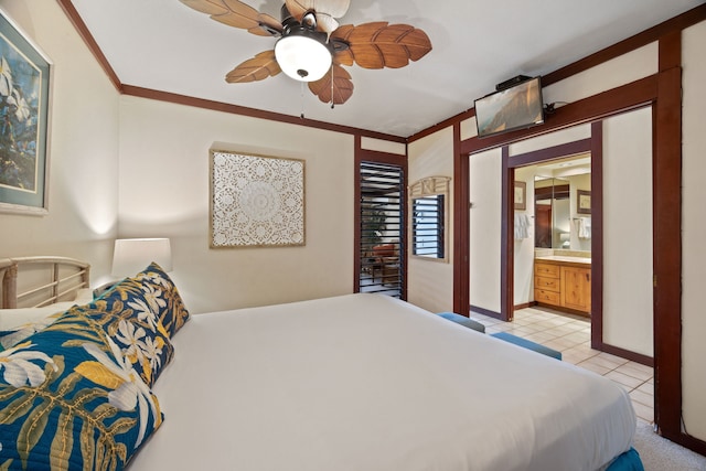 bedroom featuring ceiling fan, light tile patterned floors, ensuite bath, and ornamental molding