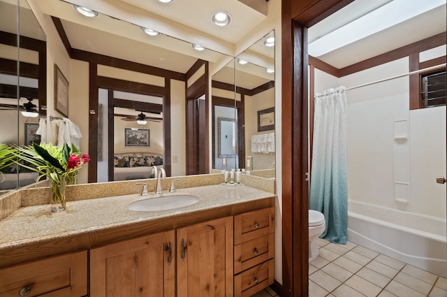 full bathroom with shower / bath combo, tile patterned floors, ceiling fan, vanity, and toilet