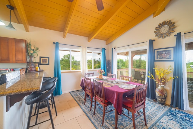 tiled dining space with wooden ceiling and lofted ceiling with beams