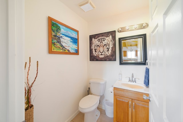 bathroom featuring vanity, toilet, and tile patterned floors