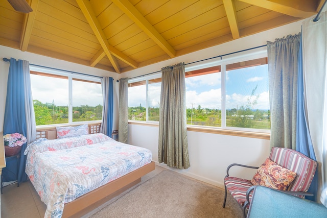 carpeted bedroom featuring vaulted ceiling with beams and wooden ceiling