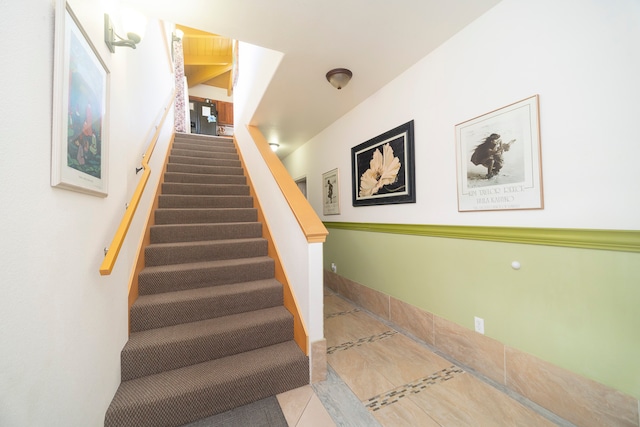 staircase with tile patterned flooring