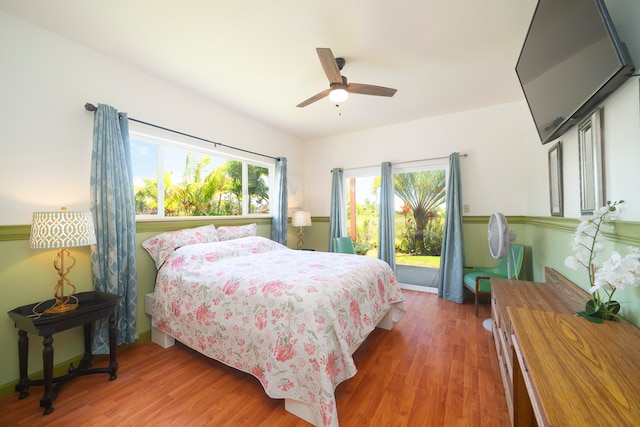 bedroom with ceiling fan and dark hardwood / wood-style flooring