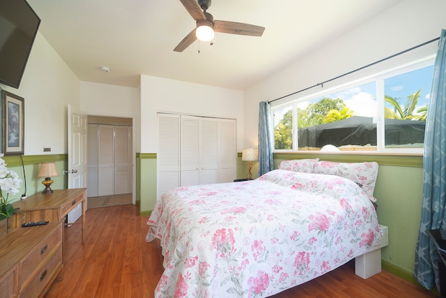 bedroom featuring ceiling fan and dark hardwood / wood-style floors