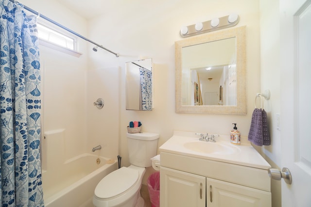 full bathroom featuring vanity, shower / bath combo with shower curtain, and toilet