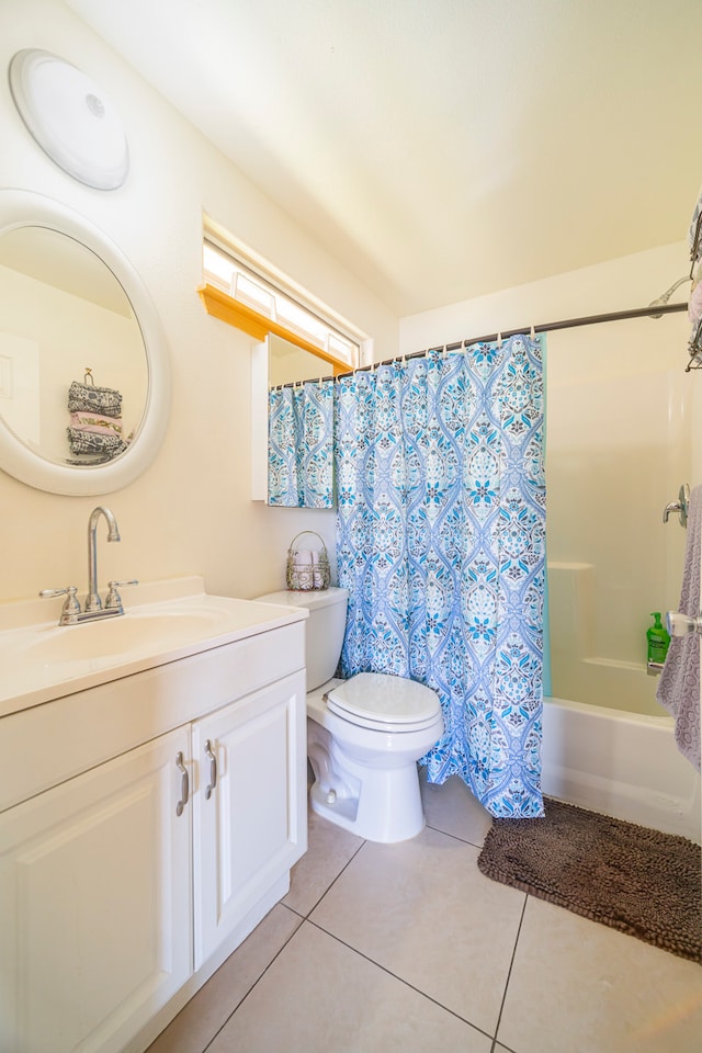 full bathroom with shower / tub combo, tile patterned flooring, vanity, and toilet