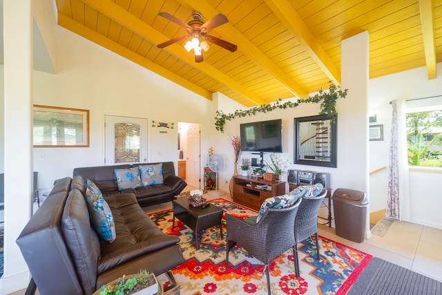 tiled living room with ceiling fan, wood ceiling, beam ceiling, and high vaulted ceiling