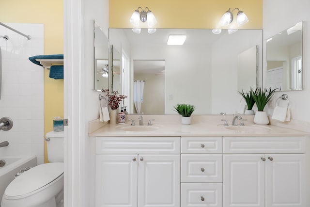 full bathroom with shower / bathtub combination with curtain, vanity, and toilet