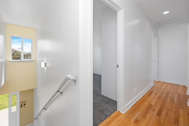 corridor with light hardwood / wood-style flooring