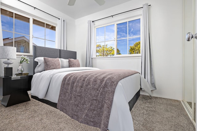 carpeted bedroom with ceiling fan