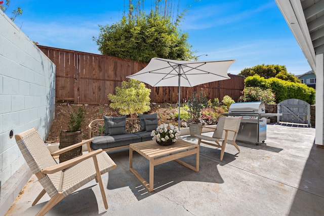 view of patio featuring an outdoor hangout area and a grill