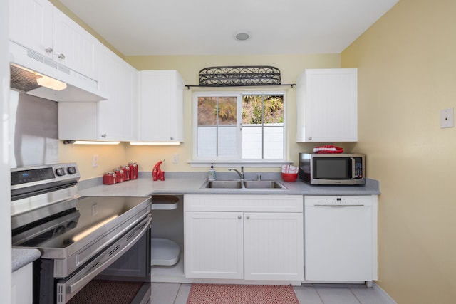 kitchen featuring white cabinets, appliances with stainless steel finishes, and sink