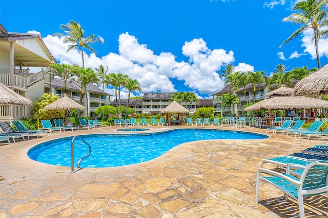 view of swimming pool with a patio area