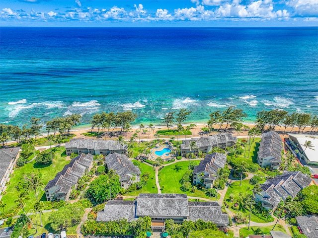 aerial view featuring a water view and a beach view