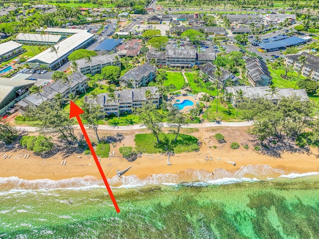 aerial view featuring a water view and a beach view