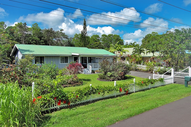 single story home featuring a front lawn and covered porch