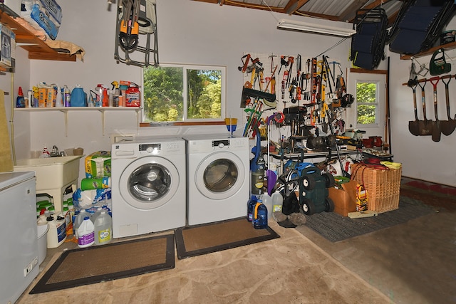 washroom with washing machine and clothes dryer