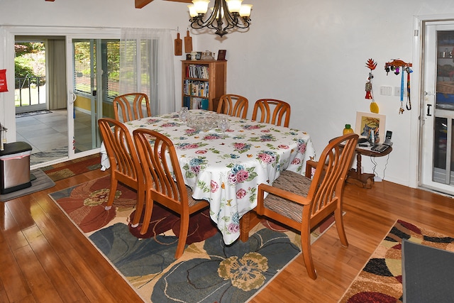 dining room featuring a notable chandelier and wood-type flooring