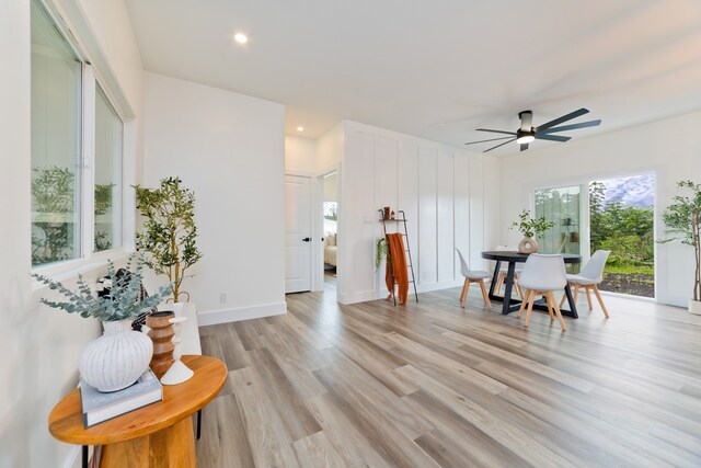 interior space featuring ceiling fan and light wood-type flooring