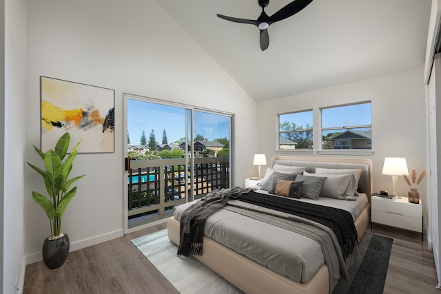 bedroom with wood-type flooring, access to exterior, ceiling fan, and high vaulted ceiling